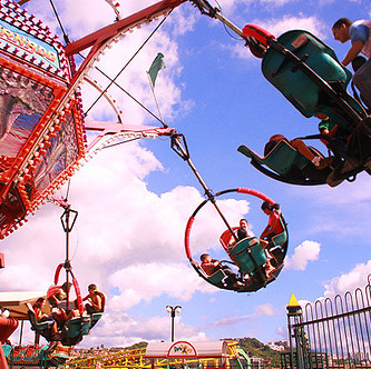 Photo of an spinning amusement park ride, taken from below